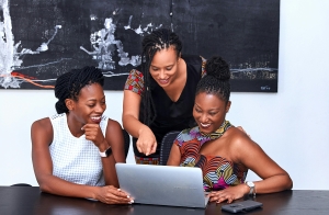 Three black women meeting for black business month to discuss black owned businesses in Orlando.